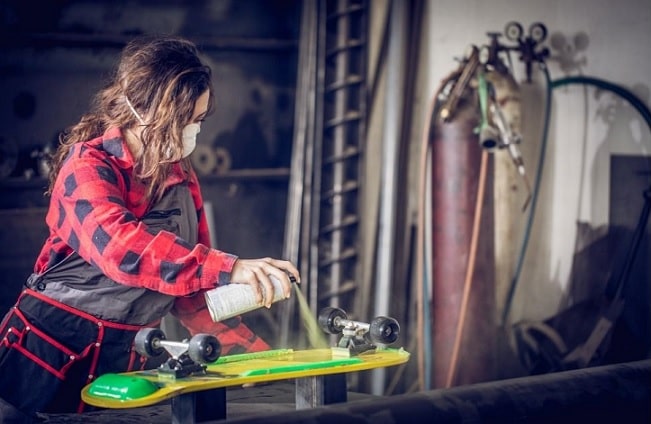 Spray painting skateboard