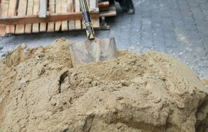 masonry sand and shovel
